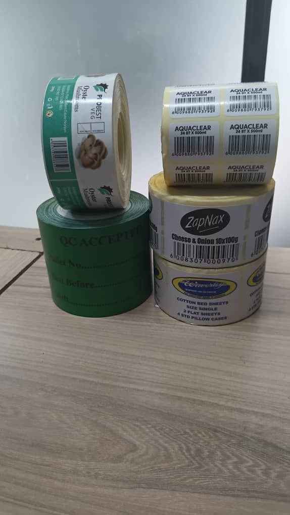 Rolls of custom printed labels made by Absolute Packaging